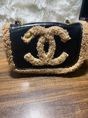 AAA  Black Leather Crossbody with Tan Shearling Trim and CC Logo